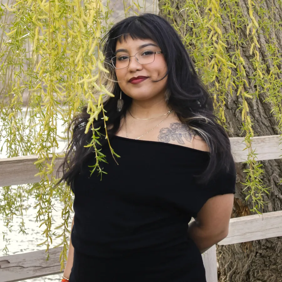 Portrait framed by hanging willow branches
