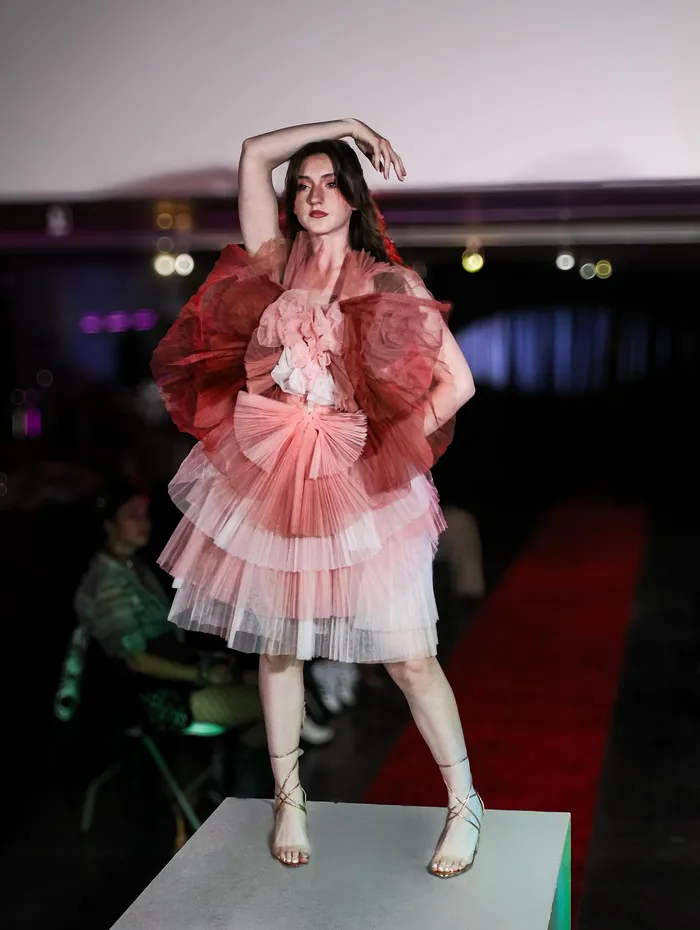 Runway look in a rose tiered gown