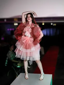 Runway look in a rose tiered gown
