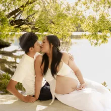 Couple kissing beside the lake