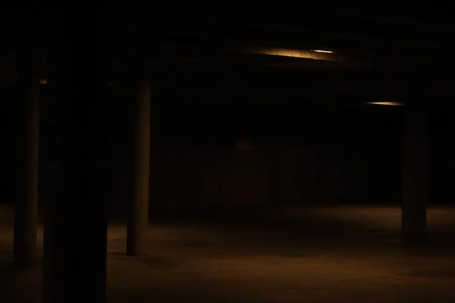 Empty parking garage under a single sodium light